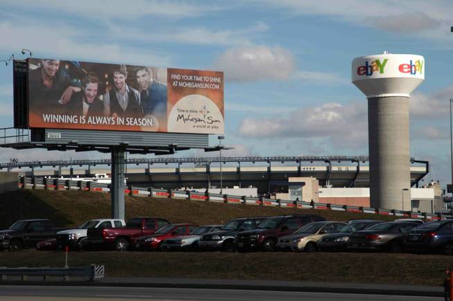 A sign advertising the Mohegan Sun casino in Connecticut is visible to drivers approaching Gillette Stadium from the south. It's the largest and closest billboard to the stadium along the road.
